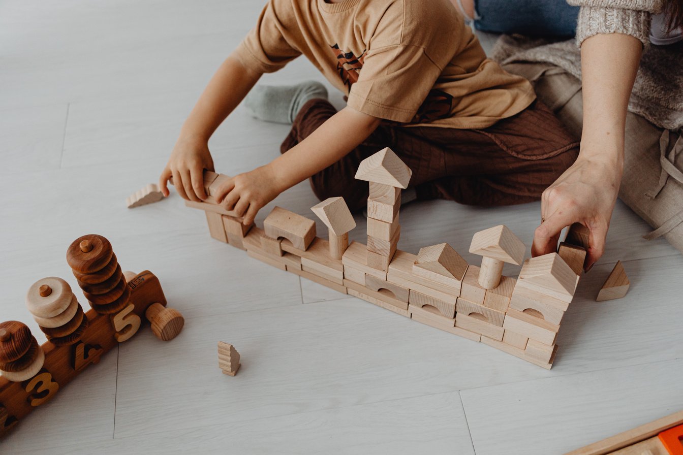 Boy Building with Toy Blocks